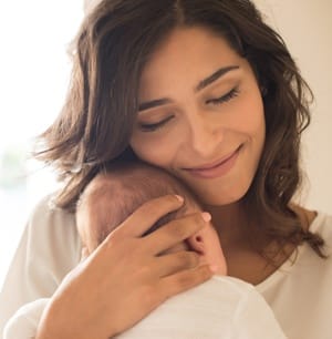 Woman with newborn baby